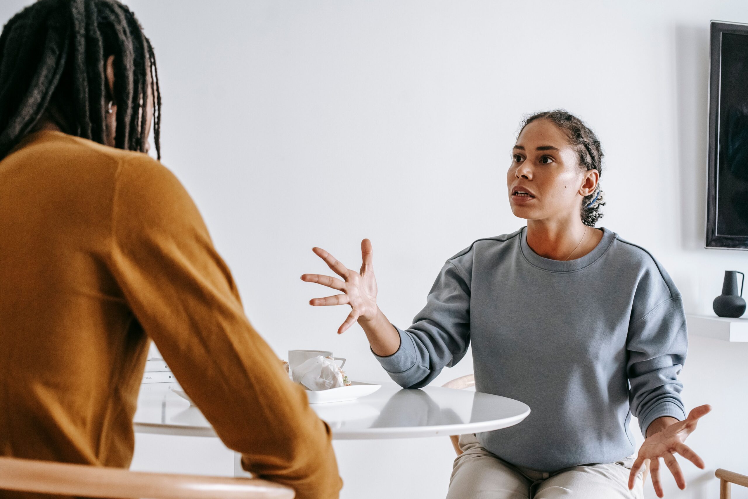 Therapist explaining communication techniques during couples therapy