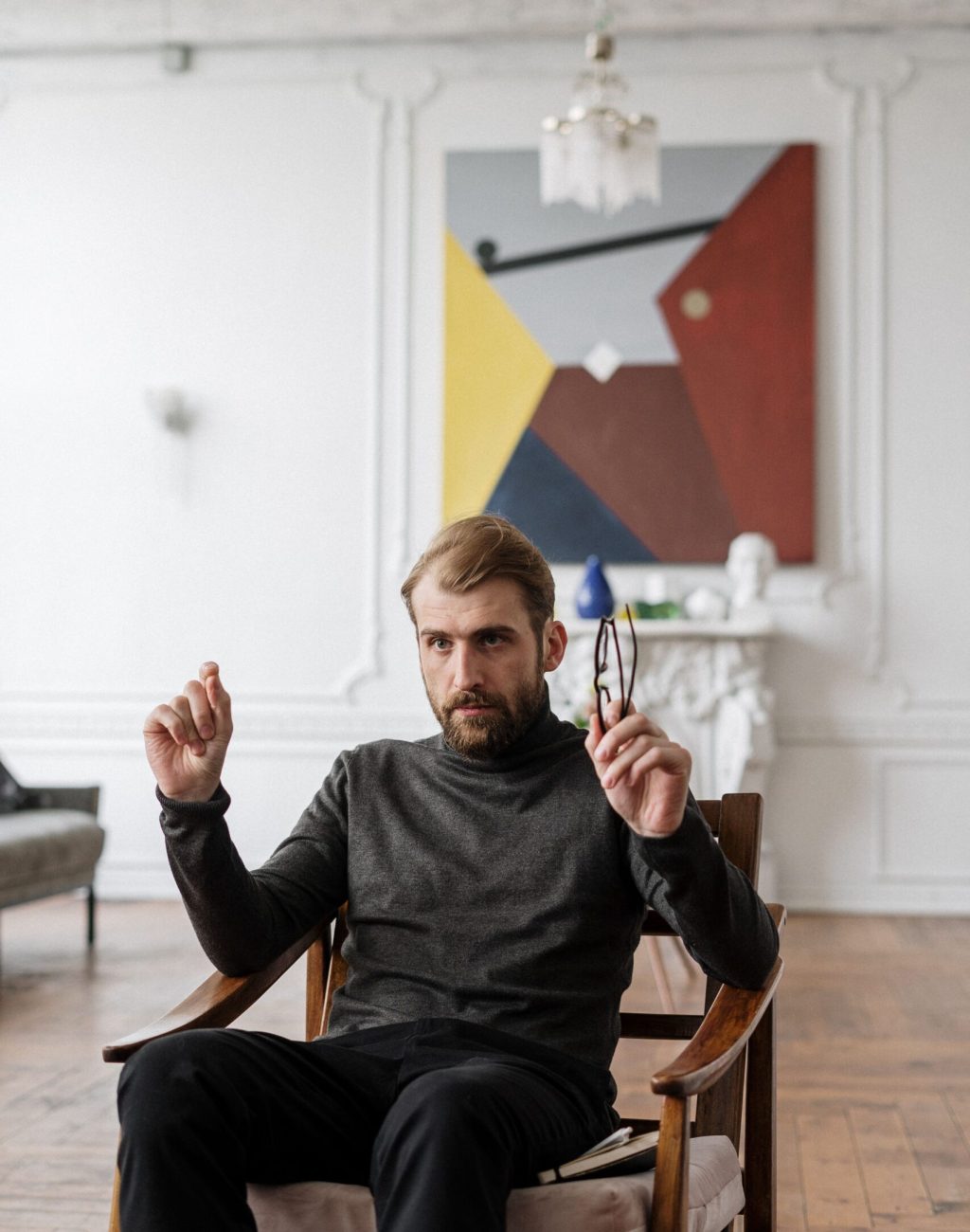 The man sitting on the chair share his life transitions therapy work