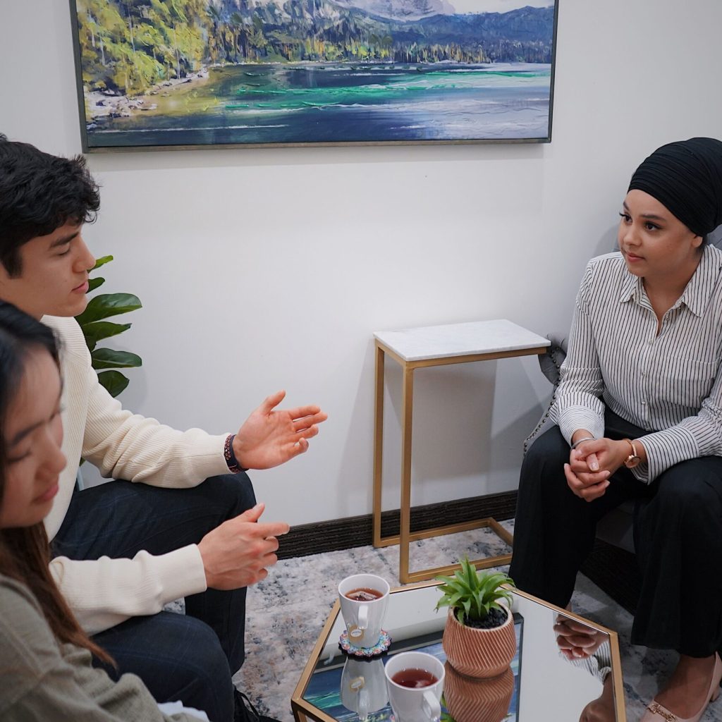 Therapist speaking with clients during a couples counseling appointment
